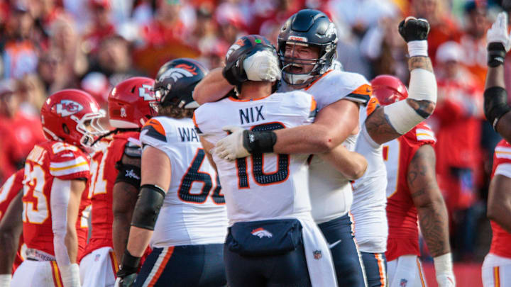KANSAS CITY, MO - NOVEMBER 10: Denver Broncos offensive tackle Mike McGlinchey (69) hugs Denver Broncos quarterback Bo Nix (10) after a touchdown against the Kansas City Chiefs on November 10th, 2024 at GEHA Field Arrowhead Stadium in Kansas City, Missouri. KANSAS CITY, MO - NOVEMBER 10: Denver Broncos offensive tackle Mike McGlinchey (69) hugs Denver Broncos quarterback Bo Nix (10) after a touchdown against the Kansas City Chiefs on November 10th, 2024 at GEHA Field Arrowhead Stadium in Kansas City, Missouri.