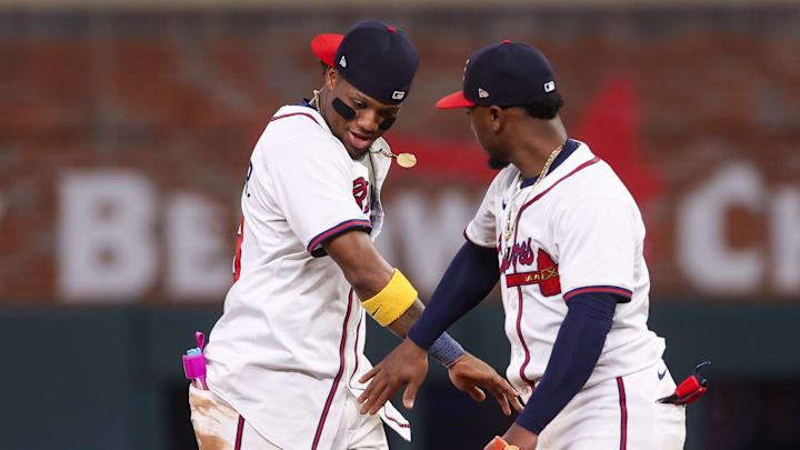 Jun 19, 2025; Atlanta, Georgia, USA; Atlanta Braves right fielder Ronald Acuna Jr. (13) and second baseman Ozzie Albies (1) celebrate after a victory over the New York Mets at Truist Park. Mandatory Credit: Brett Davis-Imagn Images
