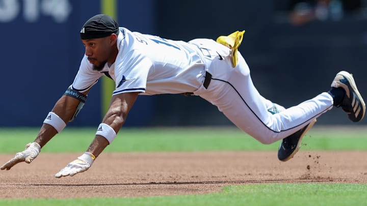 Sep 18, 2025; Tampa, Florida, USA; Tampa Bay Rays center fielder Chandler Simpson (14) slides into second base on a double against the Toronto Blue Jays in the first inning at George M. Steinbrenner Field.