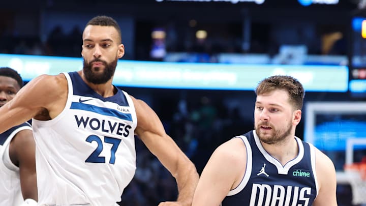 May 28, 2024; Dallas, Texas, USA; Dallas Mavericks guard Luka Doncic (77) dribbles against Minnesota Timberwolves center Rudy Gobert (27) during the third quarter of game four of the western conference finals for the 2024 NBA playoffs at American Airlines Center. Mandatory Credit: Kevin Jairaj-Imagn Images