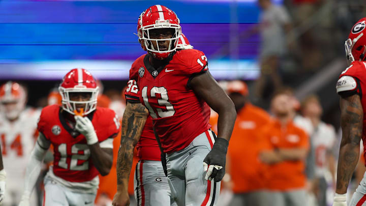 Aug 31, 2024; Atlanta, Georgia, USA; Georgia Bulldogs defensive lineman Mykel Williams (13) celebrates after a tackle against the Clemson Tigers in the third quarter at Mercedes-Benz Stadium. Mandatory Credit: Brett Davis-Imagn Images