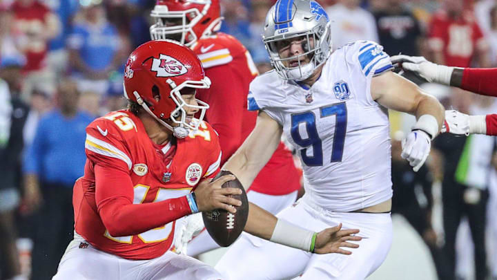 Lions defensive end Aidan Hutchinson looks to tackle Chiefs quarterback Patrick Mahomes. Lions defensive end Aidan Hutchinson looks to tackle Chiefs quarterback Patrick Mahomes.