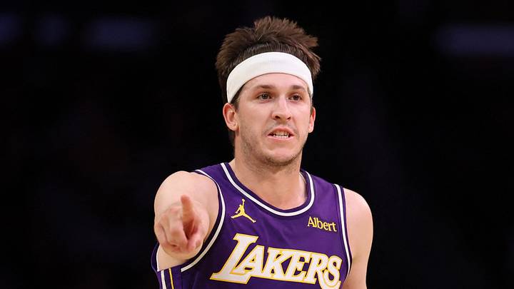 Oct 23, 2026; Los Angeles, California, USA;  Los Angeles Lakers guard Austin Reaves (15) brings the ball up court against Los Angeles Clippers guard Kobe Sanders (4) during the second quarter at Crypto.com Arena. Mandatory Credit: Kiyoshi Mio-Imagn Images