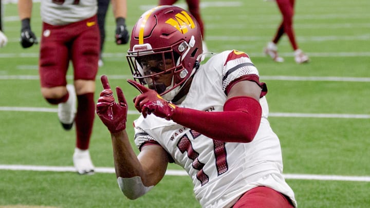 Dec 15, 2024; New Orleans, Louisiana, USA;  Washington Commanders wide receiver Terry McLaurin (17) celebrates a touchdown against the New Orleans Saints cornerback Kool-Aid McKinstry (14) during the first half at Caesars Superdome. Mandatory Credit: Matthew Hinton-Imagn Images