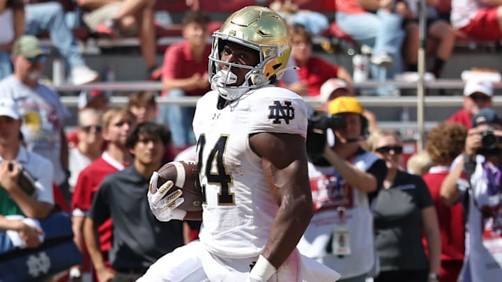 Sep 27, 2025; Fayetteville, Arkansas, USA; Notre Dame Fighting Irish running back Jadarian Price (24) rushes for a touchdown during the third quarter against the Arkansas Razorbacks at Donald W. Reynolds Razorback Stadium. Notre Dame won 56-13. Mandatory Credit: Nelson Chenault-Imagn Images