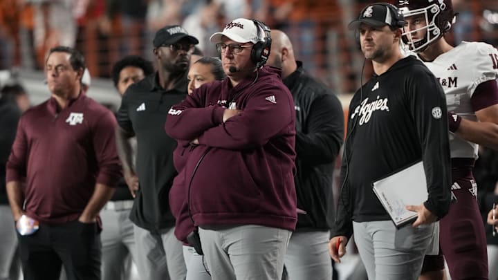 Head coach Mike Elko watches the first half of play against the Texas Longhorns. Head coach Mike Elko watches the first half of play against the Texas Longhorns.