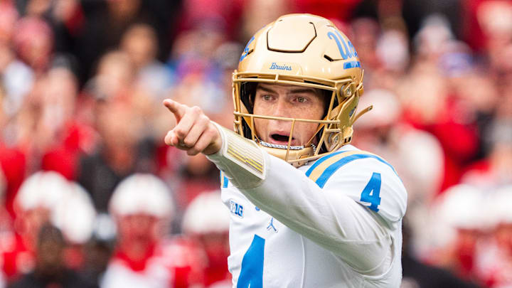 Nov 2, 2024; Lincoln, Nebraska, USA; UCLA Bruins quarterback Ethan Garbers (4) motions during the first quarter against the Nebraska Cornhuskers at Memorial Stadium. Mandatory Credit: Dylan Widger-Imagn Images