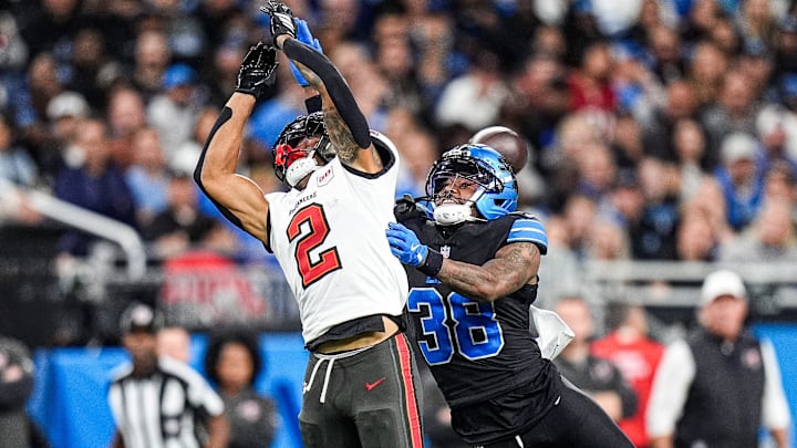 Detroit Lions cornerback Nick Whiteside (38) tackles Tampa Bay Buccaneers wide receiver Emeka Egbuka (2) Detroit Lions cornerback Nick Whiteside (38) tackles Tampa Bay Buccaneers wide receiver Emeka Egbuka (2)