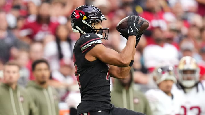Arizona Cardinals receiver Michael Wilson (14) catches a pass against the San Francisco 49ers at State Farm Stadium in Glendale on Nov. 16, 2025. Arizona Cardinals receiver Michael Wilson (14) catches a pass against the San Francisco 49ers at State Farm Stadium in Glendale on Nov. 16, 2025.