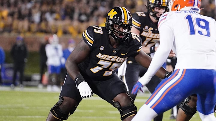 Nov 18, 2023; Columbia, Missouri, USA; Missouri Tigers offensive lineman Armand Membou (79) at the line of scrimmage against the Florida Gators during the game at Faurot Field at Memorial Stadium. Mandatory Credit: Denny Medley-Imagn Images Nov 18, 2023; Columbia, Missouri, USA; Missouri Tigers offensive lineman Armand Membou (79) at the line of scrimmage against the Florida Gators during the game at Faurot Field at Memorial Stadium. Mandatory Credit: Denny Medley-Imagn Images