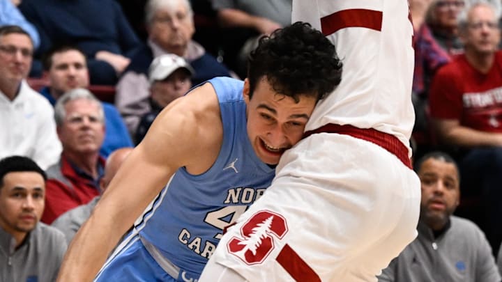 Jan 14, 2026; Stanford, California, USA; North Carolina Tar Heels guard Luka Bogavac (44) drives to the basket against Stanford Cardinal forward AJ Rohosy (4) in the second half at Maples Pavilion. Mandatory Credit: Eakin Howard-Imagn Images Jan 14, 2026; Stanford, California, USA; North Carolina Tar Heels guard Luka Bogavac (44) drives to the basket against Stanford Cardinal forward AJ Rohosy (4) in the second half at Maples Pavilion. Mandatory Credit: Eakin Howard-Imagn Images