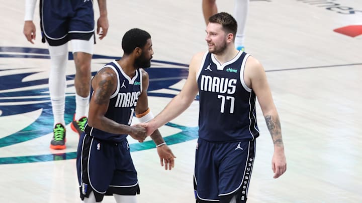 May 26, 2024; Dallas, Texas, USA; Dallas Mavericks guard Luka Doncic (77) and guard Kyrie Irving (11) react in the second half against the Minnesota Timberwolves during game three of the western conference finals for the 2024 NBA playoffs at American Airlines Center. Mandatory Credit: Kevin Jairaj-Imagn Images