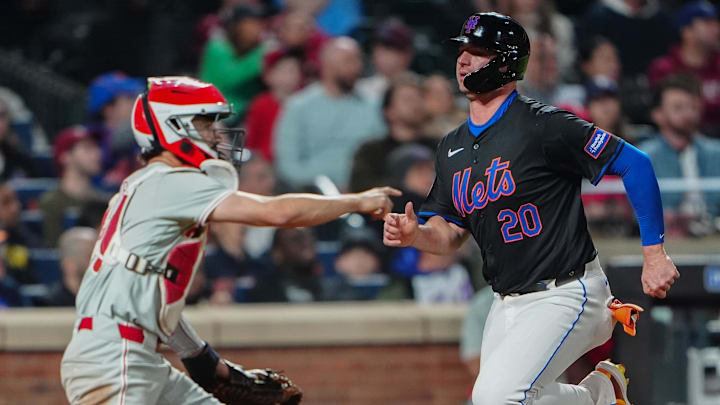 May 13, 2024; New York City, New York, USA; New York Mets first baseman Pete Alonso (20) scores a run on an error by Philadelphia Phillies third baseman Alec Bohm (not pictured) during the seventh inning at Citi Field