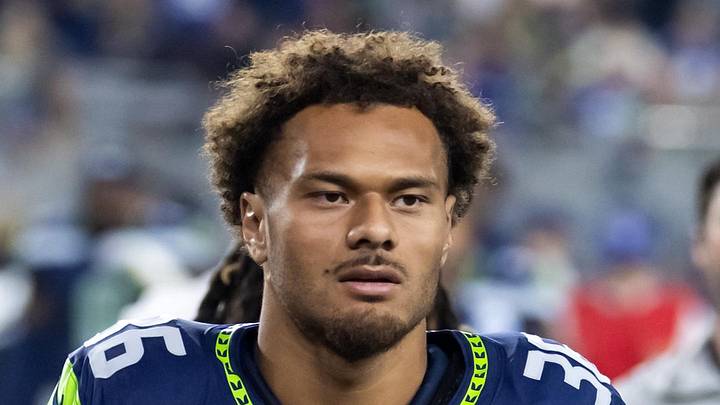 Seattle Seahawks running back George Holani runs off the field