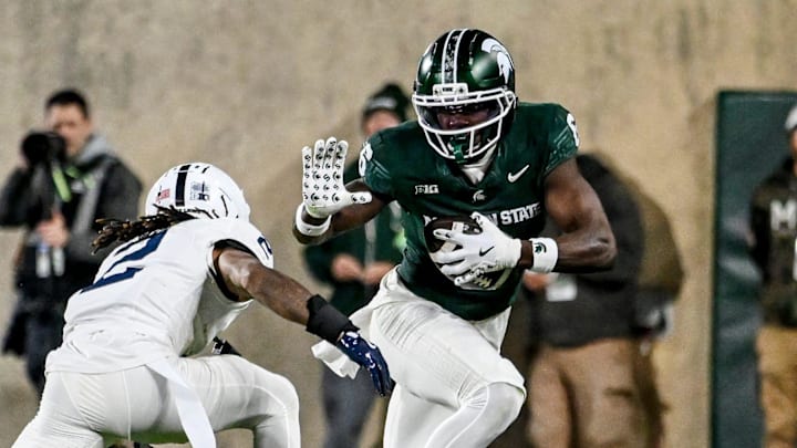 Michigan State's Nick Marsh, right, catches a pass as Penn State's Audavion Collins closes in during the third quarter on Saturday, Nov. 15, 2025, at Spartan Stadium in East Lansing.