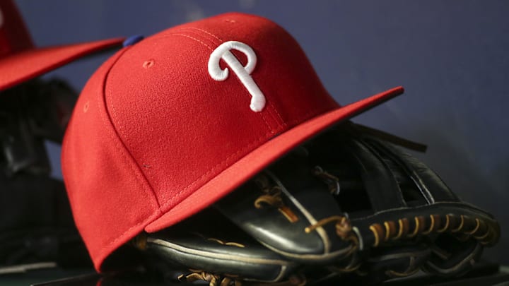 May 25, 2022; Atlanta, Georgia, USA; Detailed view of a Philadelphia Phillies hat and glove in the dugout against the Atlanta Braves in the eighth inning at Truist Park. May 25, 2022; Atlanta, Georgia, USA; Detailed view of a Philadelphia Phillies hat and glove in the dugout against the Atlanta Braves in the eighth inning at Truist Park.