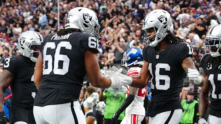 Nov 5, 2023; Paradise, Nevada, USA; Las Vegas Raiders wide receiver Jakobi Meyers (16) celebrates with Las Vegas Raiders guard Dylan Parham (66) after scoring a touchdown against the New York Giants during the first quarter at Allegiant Stadium. Mandatory Credit: Stephen R. Sylvanie-Imagn Images Nov 5, 2023; Paradise, Nevada, USA; Las Vegas Raiders wide receiver Jakobi Meyers (16) celebrates with Las Vegas Raiders guard Dylan Parham (66) after scoring a touchdown against the New York Giants during the first quarter at Allegiant Stadium. Mandatory Credit: Stephen R. Sylvanie-Imagn Images