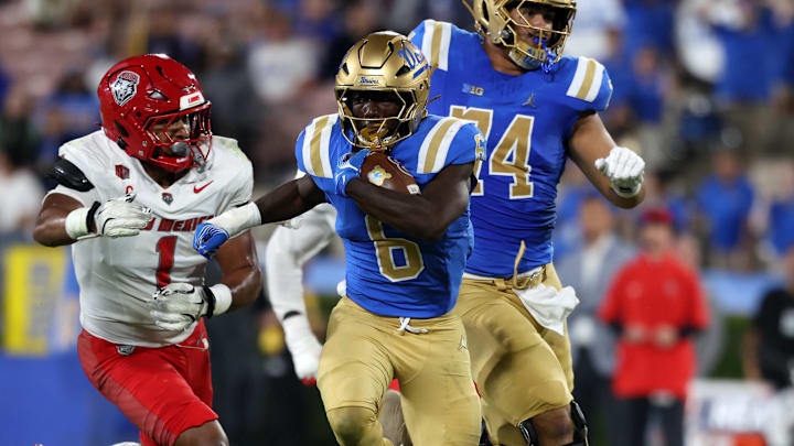 Sep 12, 2025; Pasadena, California, USA; UCLA Bruins running back Anthony Woods (6) runs with the ball during the second quarter against the New Mexico Lobos at Rose Bowl. Mandatory Credit: Kiyoshi Mio-Imagn Images Sep 12, 2025; Pasadena, California, USA; UCLA Bruins running back Anthony Woods (6) runs with the ball during the second quarter against the New Mexico Lobos at Rose Bowl. Mandatory Credit: Kiyoshi Mio-Imagn Images