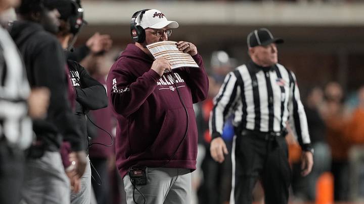 Texas A&M Aggies head coach Mike Elko calls a play during the first half against the Texas Longhorns at Darrell K Royal-Texas Memorial Stadium. Texas A&M Aggies head coach Mike Elko calls a play during the first half against the Texas Longhorns at Darrell K Royal-Texas Memorial Stadium.