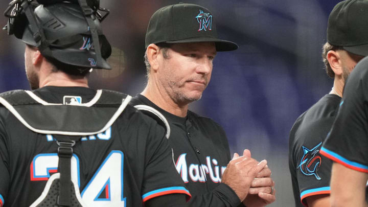 May 2, 2025; Miami, Florida, USA;  Miami Marlins manager Clayton McCullough (86) makes a pitching change in the fifth inning during the game against the Oakland Athletics at loanDepot Park. Mandatory Credit: Jim Rassol-Imagn Images