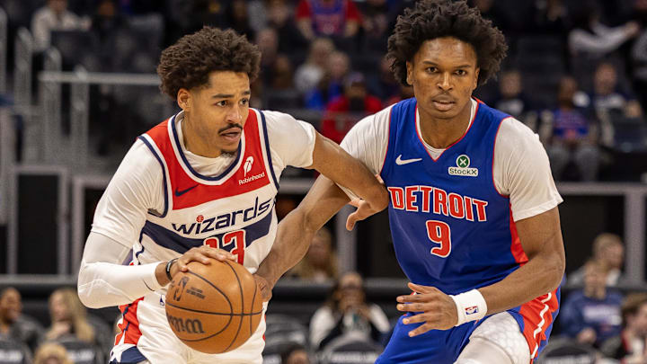 Mar 11, 2025; Detroit, Michigan, USA; Detroit Pistons forward Ausar Thompson (9) defends against Washington Wizards guard Jordan Poole (13) during the first half at Little Caesars Arena. Mandatory Credit: David Reginek-Imagn Images