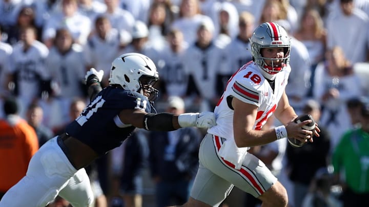 Nov 2, 2024; University Park, Pennsylvania, USA; Ohio State Buckeyes quarterback Will Howard (18) runs with the ball while being pressured by Penn State Nittany Lions defensive end Abdul Carter (11) during the second quarter at Beaver Stadium. Mandatory Credit: Matthew O'Haren-Imagn Images Nov 2, 2024; University Park, Pennsylvania, USA; Ohio State Buckeyes quarterback Will Howard (18) runs with the ball while being pressured by Penn State Nittany Lions defensive end Abdul Carter (11) during the second quarter at Beaver Stadium. Mandatory Credit: Matthew O'Haren-Imagn Images