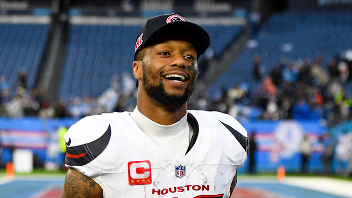 Jan 5, 2025; Nashville, Tennessee, USA;  Houston Texans running back Joe Mixon (28) smiles as he leaves the field against the Tennessee Titans during the second half at Nissan Stadium. Mandatory Credit: Steve Roberts-Imagn Images