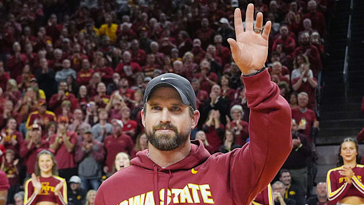 Iowa State football coach Jimmy Rogers speaks during a timeout in the first half in the Iowa State and Iowa men’s basketball Cy-Hawk series at Hilton coliseum on Dec. 11, 2025, in Ames, Iowa. Iowa State football coach Jimmy Rogers speaks during a timeout in the first half in the Iowa State and Iowa men’s basketball Cy-Hawk series at Hilton coliseum on Dec. 11, 2025, in Ames, Iowa.