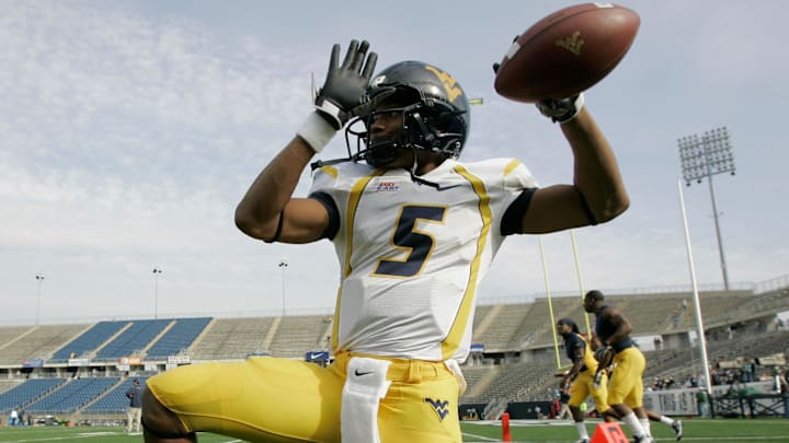 Nov 1, 2008; East Hartford, CT, USA; West Virginia Mountaineers quarterback Pat White (5) warms up before the start of the game against the Connecticut Huskies at Rentschler Field. Mandatory Credit: David Butler II-Imagn Images Nov 1, 2008; East Hartford, CT, USA; West Virginia Mountaineers quarterback Pat White (5) warms up before the start of the game against the Connecticut Huskies at Rentschler Field. Mandatory Credit: David Butler II-Imagn Images