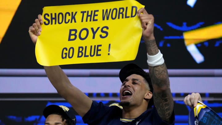 Michigan Wolverines forward Yaxel Lendeborg (23) celebrates the team’s NCAA men's basketball tournament national championship victory Monday, April 6, 2026, after defeating the UConn Huskies 69-63 at Lucas Oil Stadium in Indianapolis. Michigan Wolverines forward Yaxel Lendeborg (23) celebrates the team’s NCAA men's basketball tournament national championship victory Monday, April 6, 2026, after defeating the UConn Huskies 69-63 at Lucas Oil Stadium in Indianapolis.