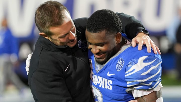 Memphis coach Ryan Silverfield hugs Mario Anderson Jr. during a senior night celebration before the game against UAB at Simmons Bank Liberty Stadium in Memphis, Tenn., on Saturday, Nov. 16, 2024.