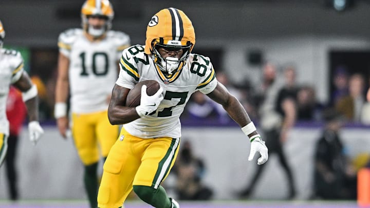 Dec 29, 2024; Minneapolis, Minnesota, USA; Green Bay Packers wide receiver Romeo Doubs (87) gets yards after the catch against the Minnesota Vikings during the fourth quarter at U.S. Bank Stadium. Mandatory Credit: Jeffrey Becker-Imagn Images
