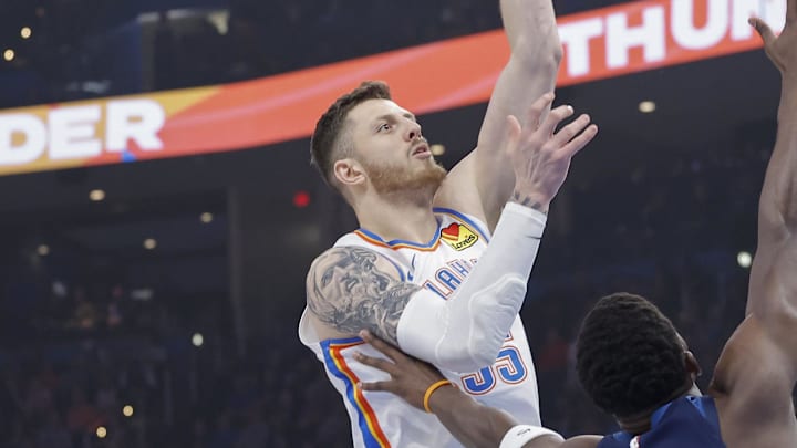 Feb 24, 2025; Oklahoma City, Oklahoma, USA; Oklahoma City Thunder center Isaiah Hartenstein (55) shoots over Minnesota Timberwolves guard Anthony Edwards (5) during the first quarter at Paycom Center. Mandatory Credit: Alonzo Adams-Imagn Images