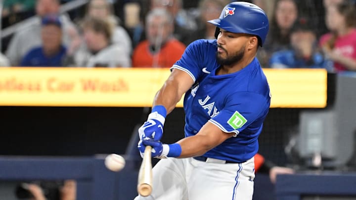 Mar 29, 2025; Toronto, Ontario, CAN; Toronto Blue Jays right fielder Anthony Santander (25) hits an RBI single against the Baltimore Orioles in the first inning at Rogers Centre