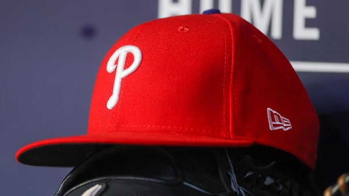 May 26, 2023; Atlanta, Georgia, USA; A detailed view of a Philadelphia Phillies hat and glove on the bench against the Atlanta Braves in the seventh inning at Truist Park. May 26, 2023; Atlanta, Georgia, USA; A detailed view of a Philadelphia Phillies hat and glove on the bench against the Atlanta Braves in the seventh inning at Truist Park.