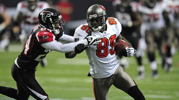 Dec 14, 2008; Atlanta, GA, USA; Atlanta Falcons cornerback Domonique Foxworth (24) tackles Tampa Bay Buccaneers wide receiver Antonio Bryant (89) in the first half at the Georgia Dome. The Falcons defeated the Buccaneers 13-10 in overtime. Mandatory Credit: Dale Zanine-Imagn Images