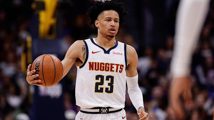 Oct 13, 2024; Denver, Colorado, USA; Denver Nuggets guard Trey Alexander (23) controls the ball in the fourth quarter against the Phoenix Suns at Ball Arena. Mandatory Credit: Isaiah J. Downing-Imagn Images