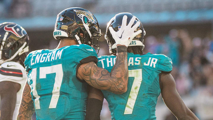 Dec 1, 2024; Jacksonville, Florida, USA; Jacksonville Jaguars tight end Evan Engram (17) and wide receiver Brian Thomas Jr (7) celebrate a touchdown against the Houston Texans in the fourth quarter at EverBank Stadium. Mandatory Credit: Jeremy Reper-Imagn Images Dec 1, 2024; Jacksonville, Florida, USA; Jacksonville Jaguars tight end Evan Engram (17) and wide receiver Brian Thomas Jr (7) celebrate a touchdown against the Houston Texans in the fourth quarter at EverBank Stadium. Mandatory Credit: Jeremy Reper-Imagn Images