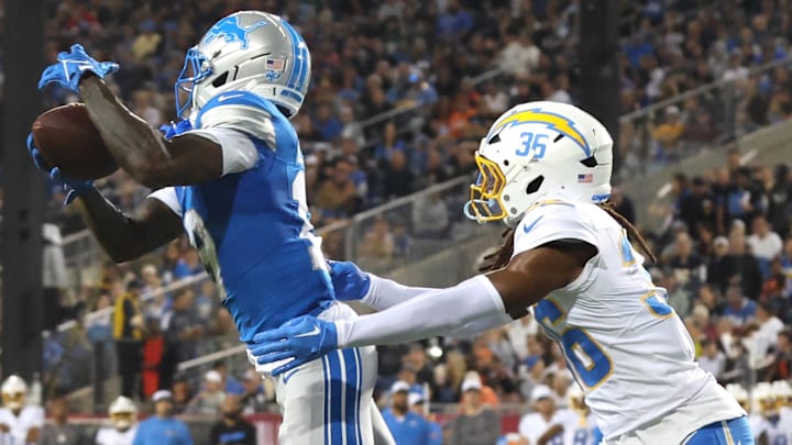 Los Angeles Chargers cornerback Ja'Sir Taylor (36) tackles Detroit Lions wide receiver Dominic Lovett (19) in the second quarter at Tom Benson Hall of Fame Stadium.
