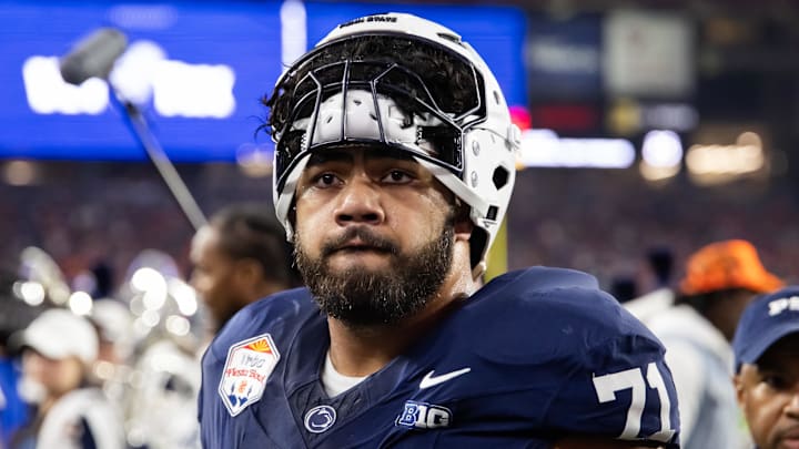 Dec 31, 2024; Glendale, AZ, USA; Penn State Nittany Lions offensive lineman Olaivavega Ioane (71) against the Boise State Broncos during the Fiesta Bowl at State Farm Stadium. Mandatory Credit: Mark J. Rebilas-Imagn Images