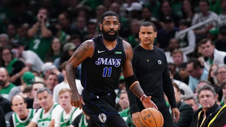 Jun 6, 2024; Boston, Massachusetts, USA; Dallas Mavericks guard Kyrie Irving (11) controls the ball against the Boston Celtics in the first quarter during game one of the 2024 NBA Finals at TD Garden. Mandatory Credit: David Butler II-USA TODAY Sports Jun 6, 2024; Boston, Massachusetts, USA; Dallas Mavericks guard Kyrie Irving (11) controls the ball against the Boston Celtics in the first quarter during game one of the 2024 NBA Finals at TD Garden. Mandatory Credit: David Butler II-USA TODAY Sports