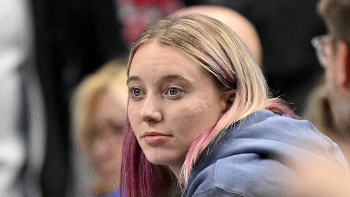 Nov 19, 2025; Dallas, Texas, USA; Dallas Wings point guard Paige Bueckers watches the game between the Dallas Mavericks and the New York Knicks during the second half at the American Airlines Center. Mandatory Credit: Jerome Miron-Imagn Images
