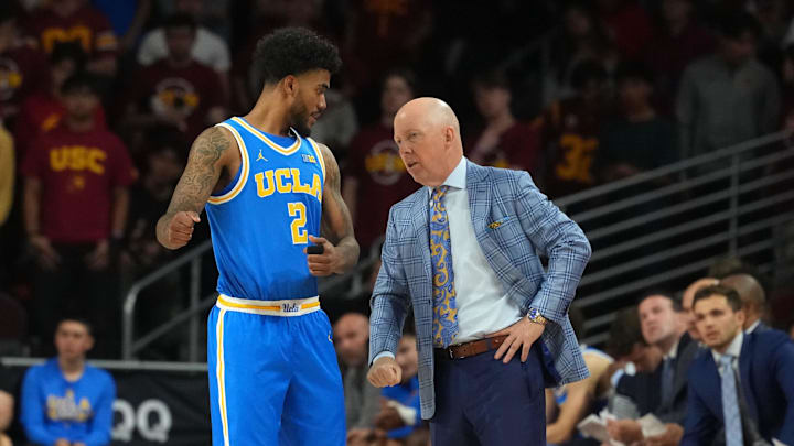 Mar 7, 2026; Los Angeles, California, USA; UCLA Bruins guard Donovan Dent (2) talks with head coach Mick Cronin against the Southern California Trojans first half at Galen Center. Mandatory Credit: Kirby Lee-Imagn Images Mar 7, 2026; Los Angeles, California, USA; UCLA Bruins guard Donovan Dent (2) talks with head coach Mick Cronin against the Southern California Trojans first half at Galen Center. Mandatory Credit: Kirby Lee-Imagn Images