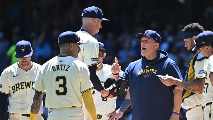 May 30, 2024; Milwaukee, Wisconsin, USA; Milwaukee Brewers manager Pat Murphy (21) has some instructions for  relief pitcher Bryan Hudson (52) as he enter the game in the seventh inning against the Chicago Cubs at American Family Field. Mandatory Credit: Michael McLoone-Imagn Images