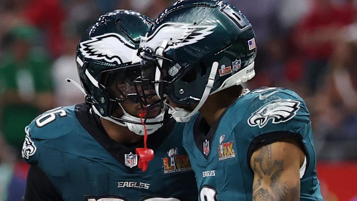 Philadelphia Eagles wide receiver DeVonta Smith (6) celebrates with running back Saquon Barkley (26).
