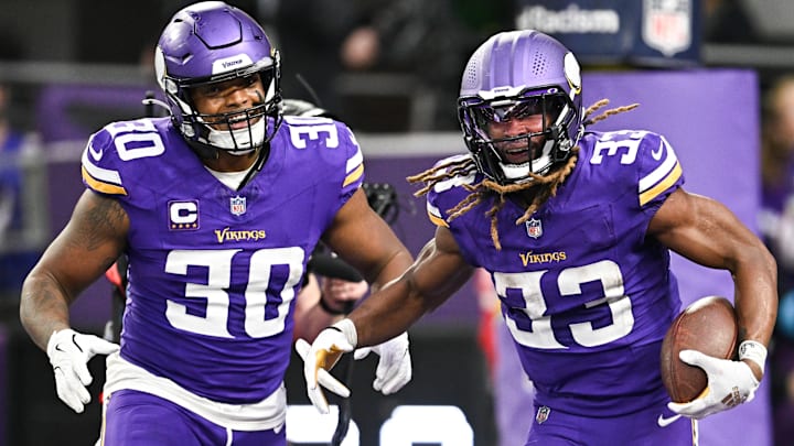 Minnesota Vikings FB C.J. Ham (30) and RB Aaron Jones (33)