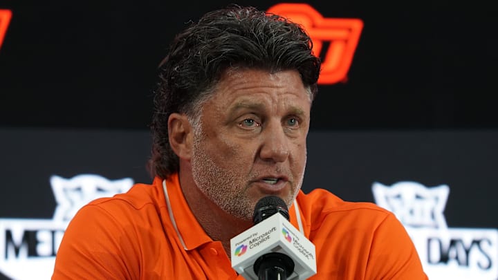 Jul 9, 2025; Frisco, TX, USA; Oklahoma State head coach Mike Gundy speaks with the media during 2025 Big 12 Football Media Days at The Star. Mandatory Credit: Raymond Carlin III-Imagn Images Jul 9, 2025; Frisco, TX, USA; Oklahoma State head coach Mike Gundy speaks with the media during 2025 Big 12 Football Media Days at The Star. Mandatory Credit: Raymond Carlin III-Imagn Images