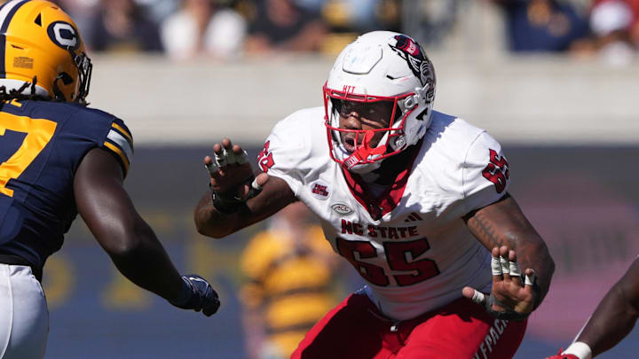 Oct 19, 2024; Berkeley, California, USA; North Carolina State Wolfpack offensive tackle Jacarrius Peak (65) blocks against California Golden Bears linebacker Cheikhsaliou Fall (17) during the second quarter at California Memorial Stadium. Mandatory Credit: Darren Yamashita-Imagn Images Oct 19, 2024; Berkeley, California, USA; North Carolina State Wolfpack offensive tackle Jacarrius Peak (65) blocks against California Golden Bears linebacker Cheikhsaliou Fall (17) during the second quarter at California Memorial Stadium. Mandatory Credit: Darren Yamashita-Imagn Images