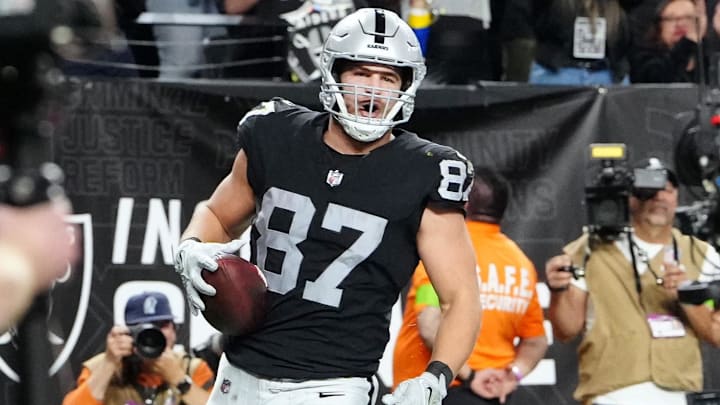 Dec 14, 2023; Paradise, Nevada, USA; Las Vegas Raiders tight end Michael Mayer (87) celebrates after scoring a touchdown in the second quarter against the Los Angeles Chargers at Allegiant Stadium. Mandatory Credit: Stephen R. Sylvanie-Imagn Images Dec 14, 2023; Paradise, Nevada, USA; Las Vegas Raiders tight end Michael Mayer (87) celebrates after scoring a touchdown in the second quarter against the Los Angeles Chargers at Allegiant Stadium. Mandatory Credit: Stephen R. Sylvanie-Imagn Images
