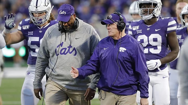 Buddy Wyatt walks with Kansas State head coach Chris Klieman during a game in the 2019-20 season at Bill Snyder Family Stadium in Manhattan, Kansas.
